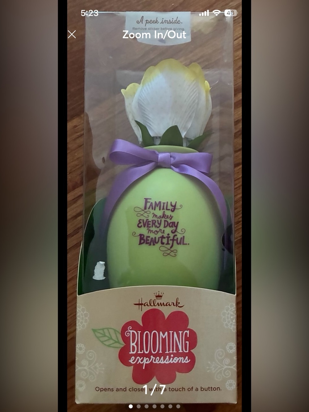 Hallmark blooming flower in vase. Press a button and flower opens.